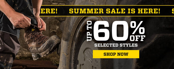Ambler Safety's promotional sale graphic with large text reading 'SUMMER SALE IS HERE!', 'UP TO 60% OFF', and 'SHOP NOW' over a lifestyle photo of a person tying his laces of an Amblers Safety boot near a tire.